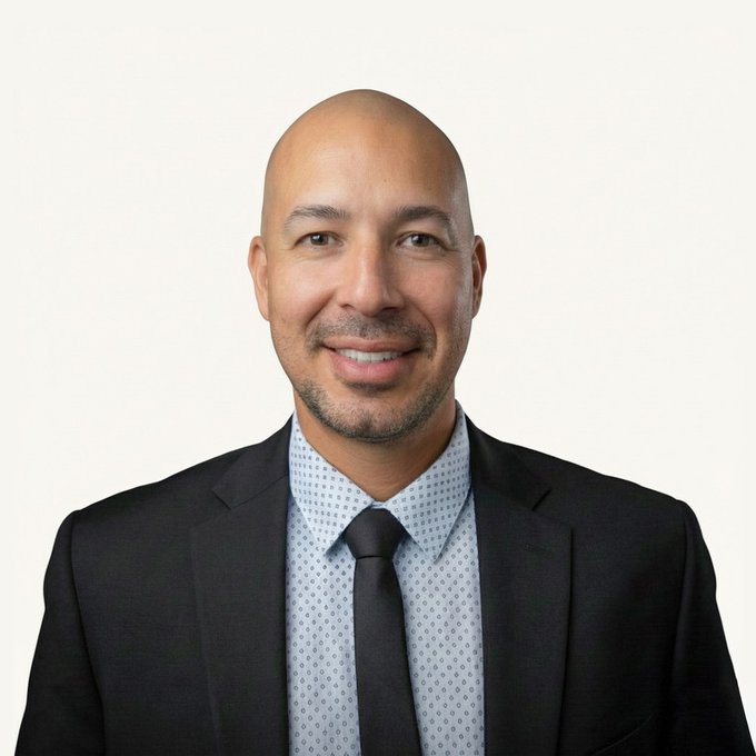 Attorney Corey A. Pingle in a dark suit against a plain background